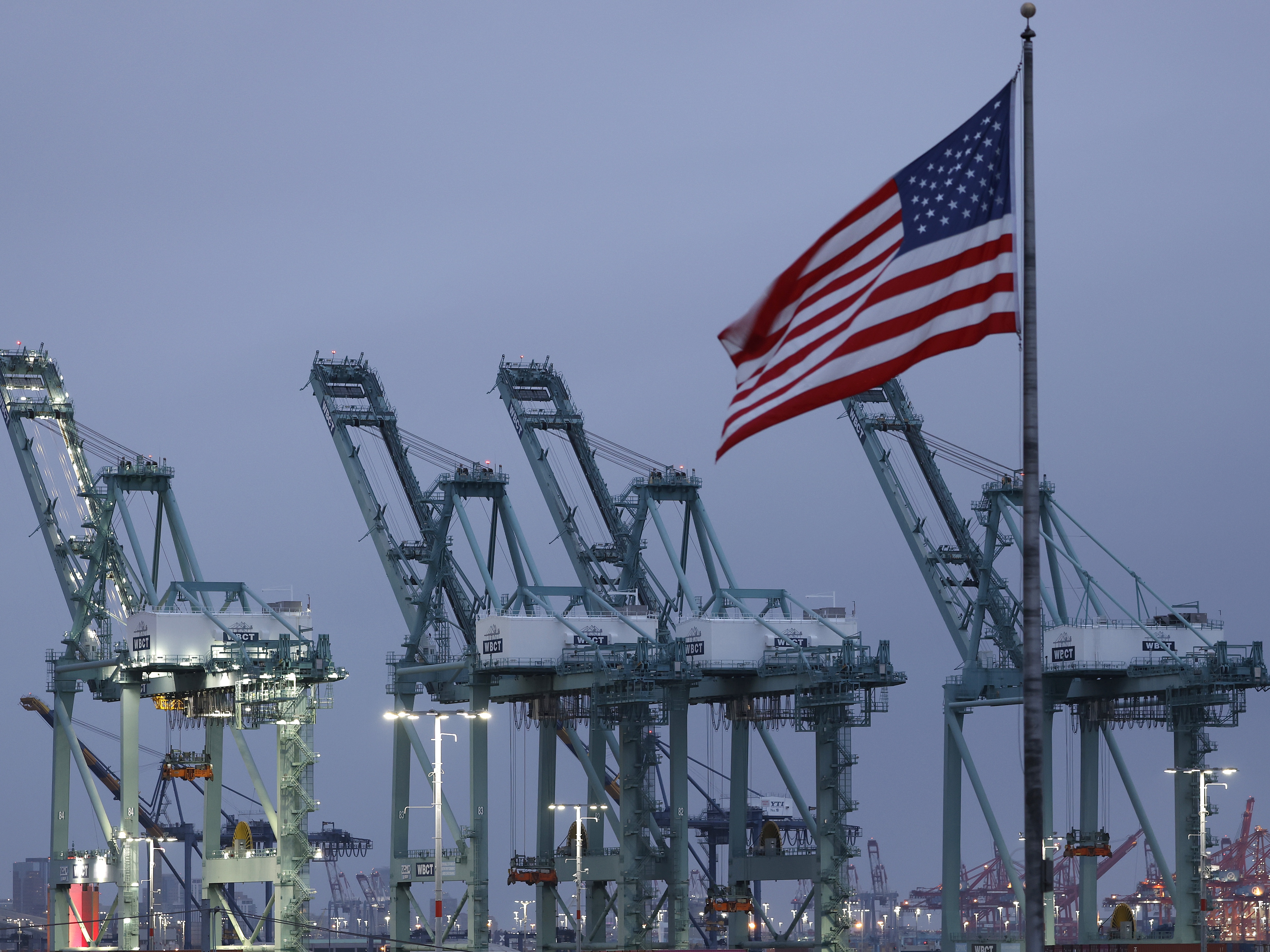 caption: A view of shipping cranes at the Port of Los Angeles on May 06, 2025 in San Pedro, California. Los Angeles and Long Beach ports are seeing significant drops in expected cargo ships coming into port this week due to tariffs imposed by the Trump Administration.