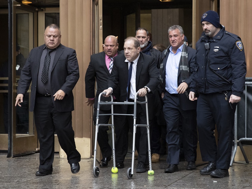 caption: Harvey Weinstein leaves court following a hearing over allegations he violated bail conditions by mishandling his electronic ankle monitor this week in New York.