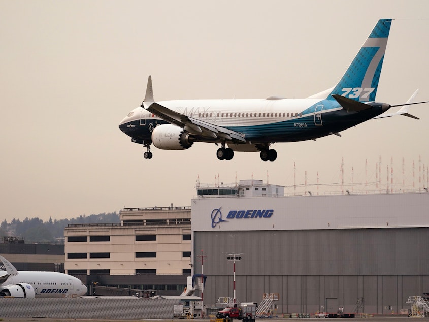 caption: A Boeing 737 MAX jet, piloted by Federal Aviation Administration chief Stephen Dickson, prepares to land at Boeing Field following a test flight late September in Seattle.