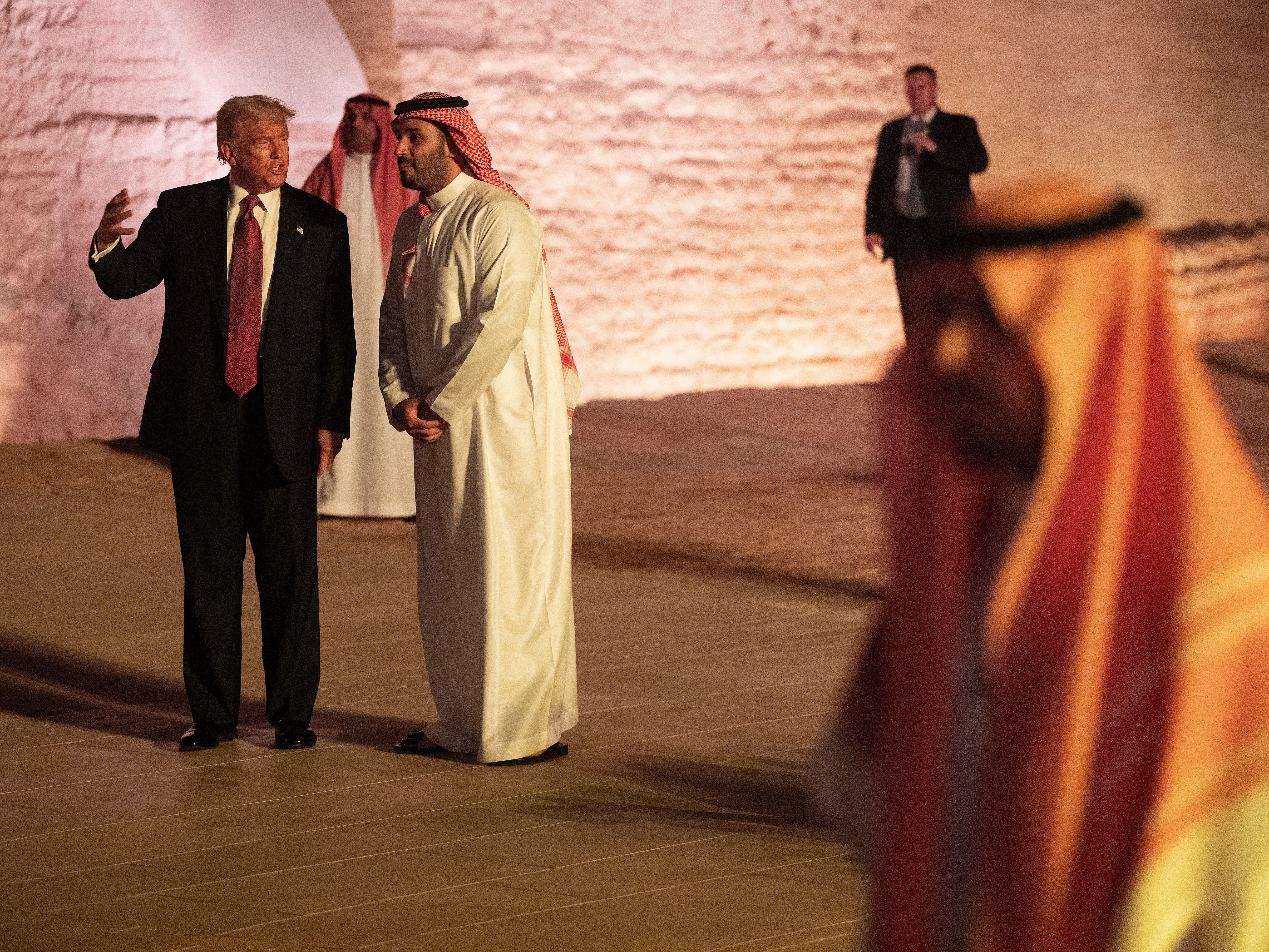 caption: President Trump and Saudi Arabia's Crown Prince Mohammed bin Salman walk in the old district on the outskirts of the Saudi capital Riyadh on May 13. Trump announced several big economic agreements on his recent trip to the Middle East, but said little about the conflicts in the region.