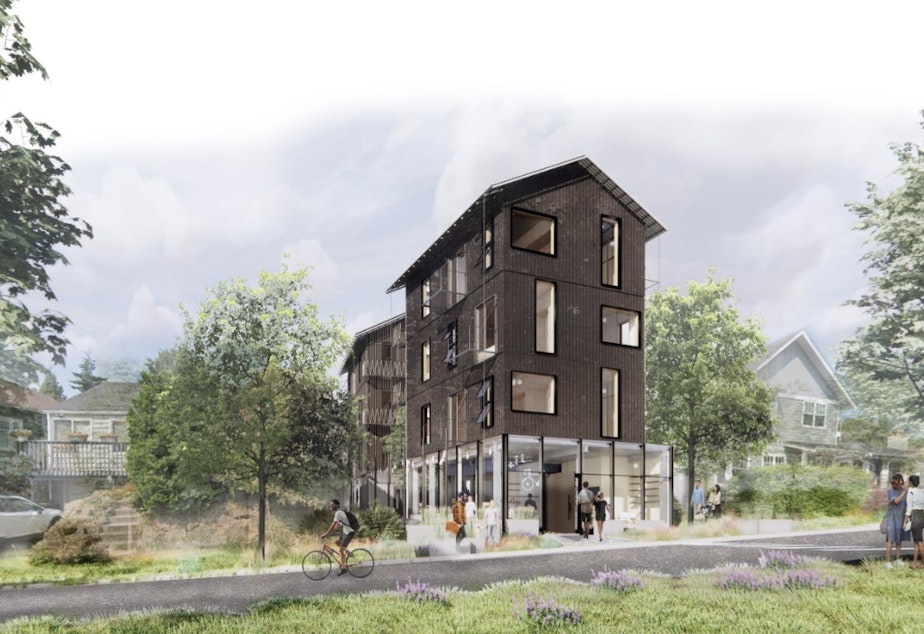 caption: While many projects compromised on density in deference to community feelings, Logan White's project explored a more aggressive approach to density, in order to drive costs down. One benefit the community gets in exchange is the coffee shop on the ground floor of this project, turning the building into a community gathering space.