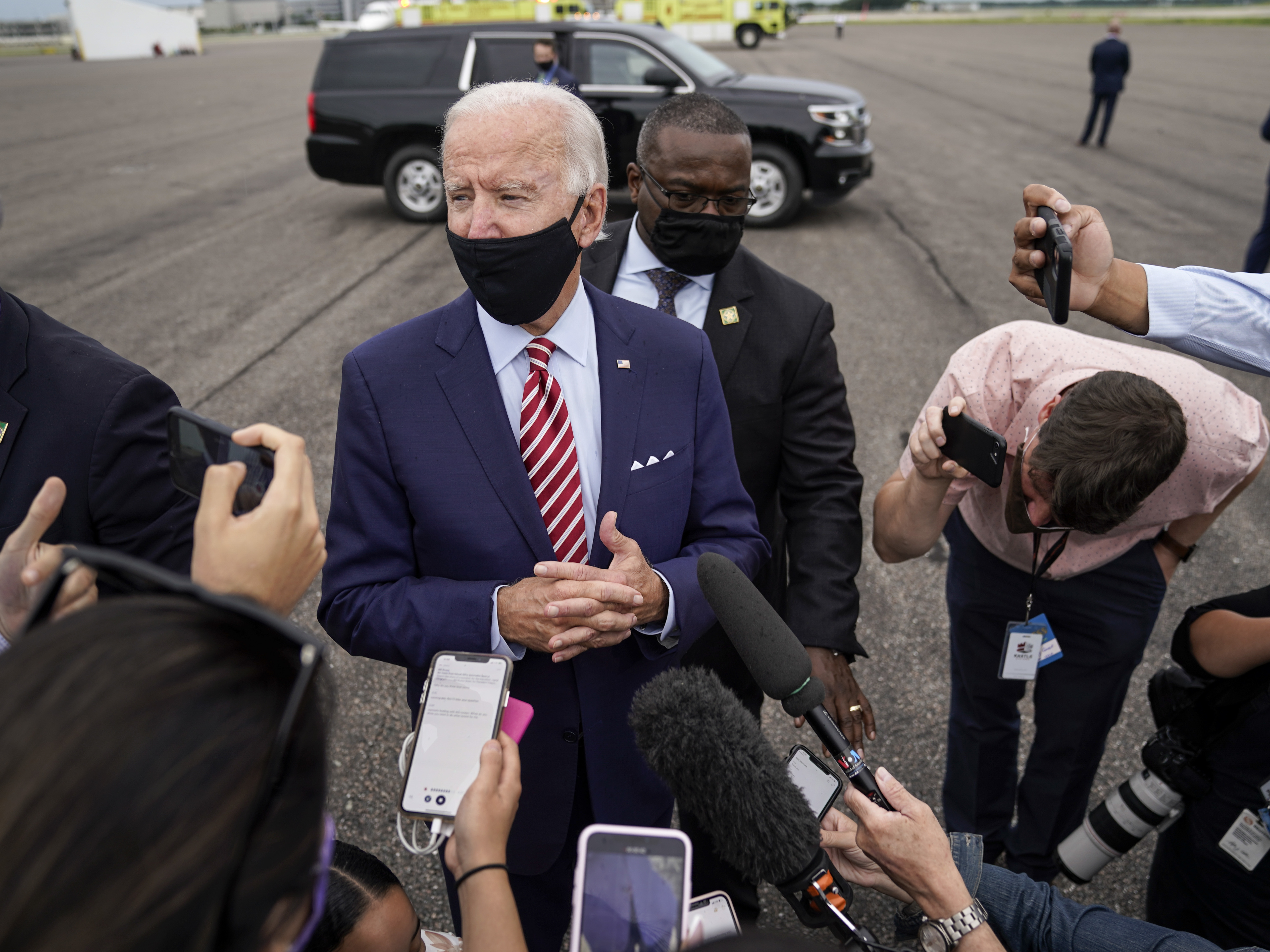 caption: Democratic presidential nominee Joe Biden speaks to reporters before boarding his plane in Florida on Tuesday. Biden leads by 9 points against President Trump, who continues to face an uphill reelection battle.