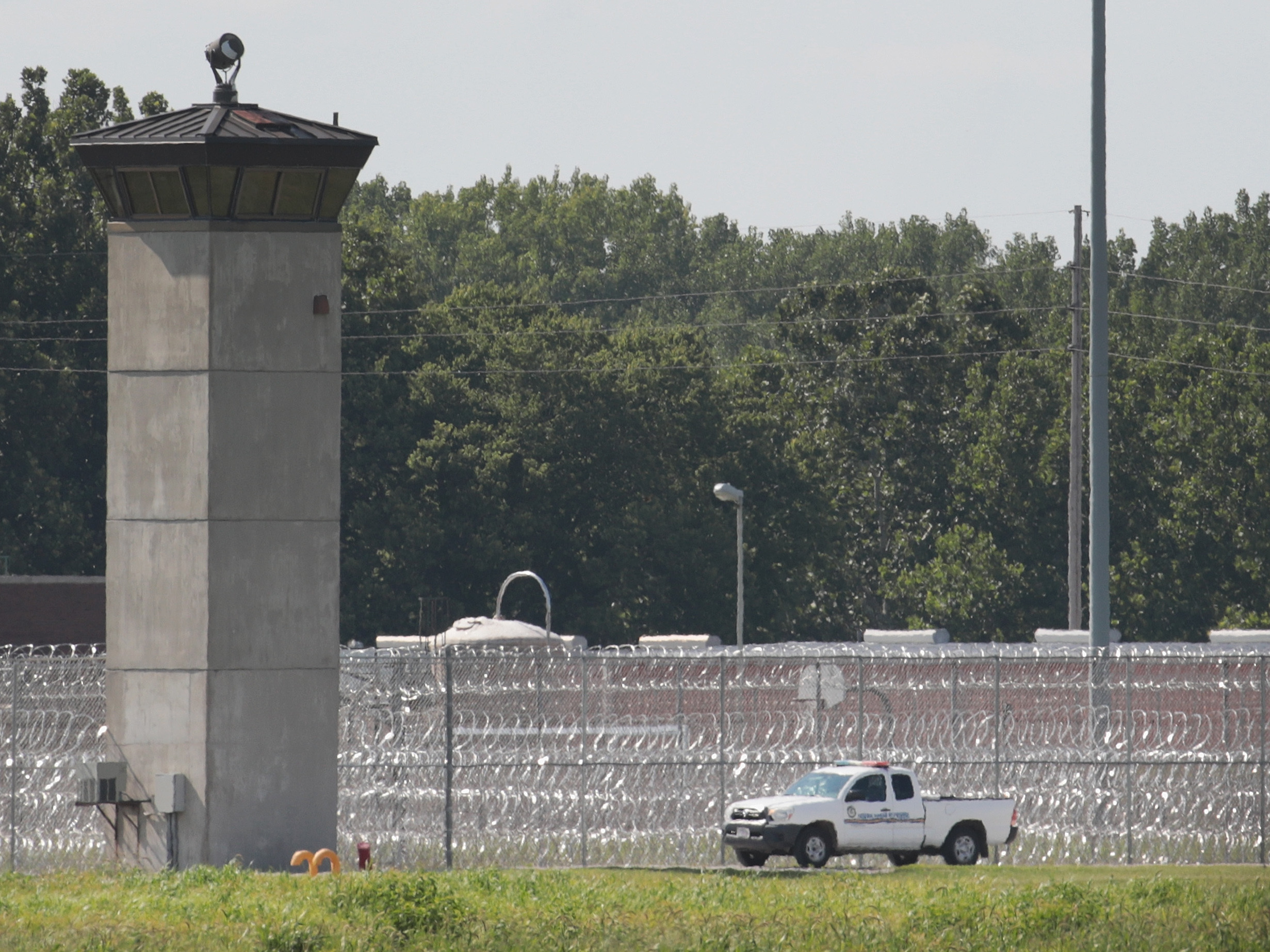 caption: A truck is used to patrol the grounds of the Federal Correctional Complex Terre Haute on July 25, 2019 in Terre Haute, Indiana.