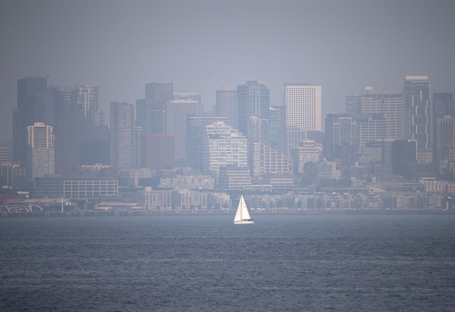 caption: A hazy Seattle skyline is shown on Tuesday, August 14, 2018, from Hamilton Viewpoint Park in West Seattle. 