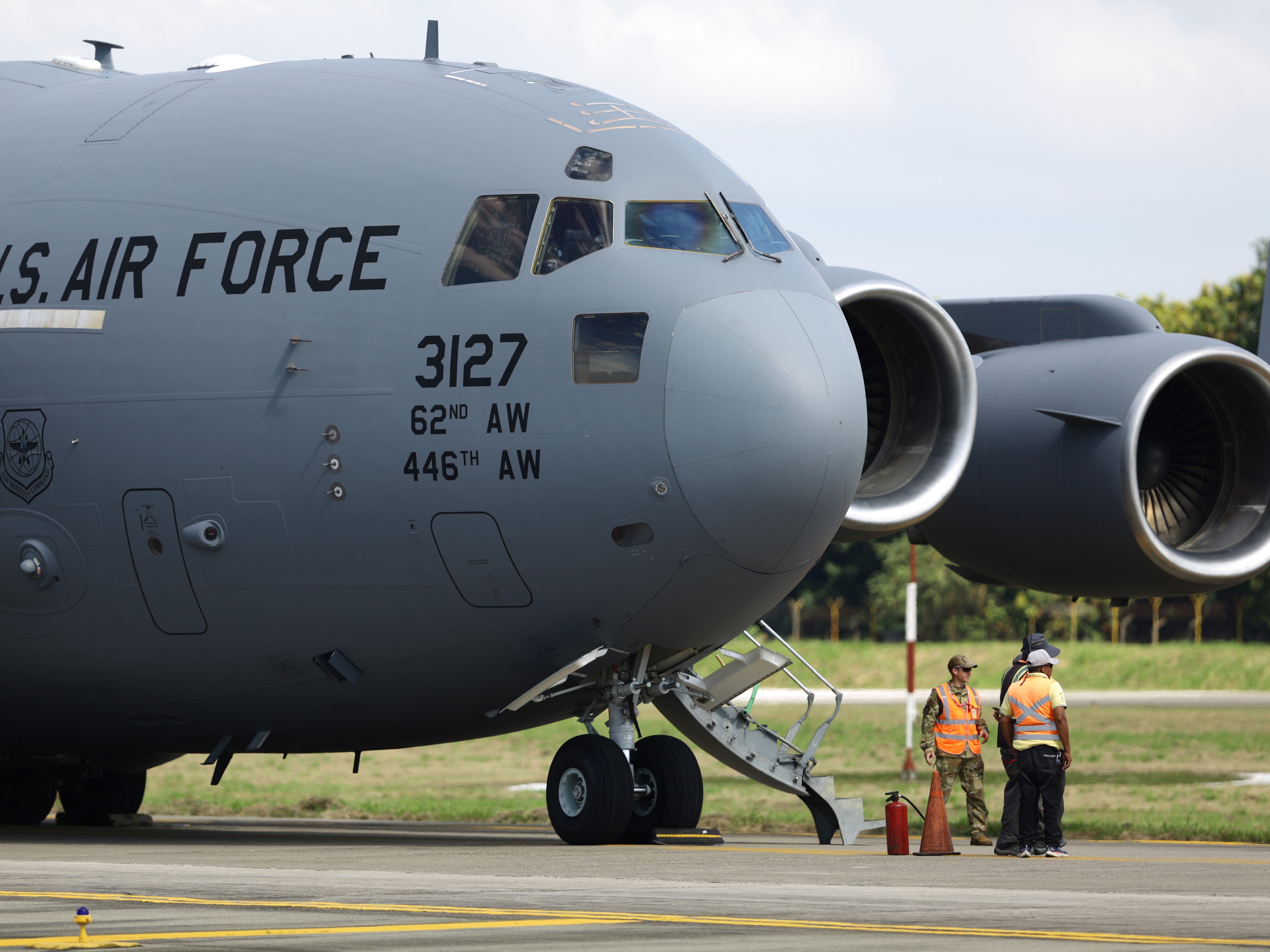 caption: A U.S. Air force flight carrying migrants deported by the US government arrives at Ramon Villeda Morales International Airport in January 2025 in San Pedro Sula, Honduras.