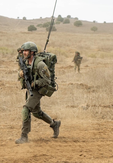 caption: Shneur deployed with the Israel Defense Forces. 
