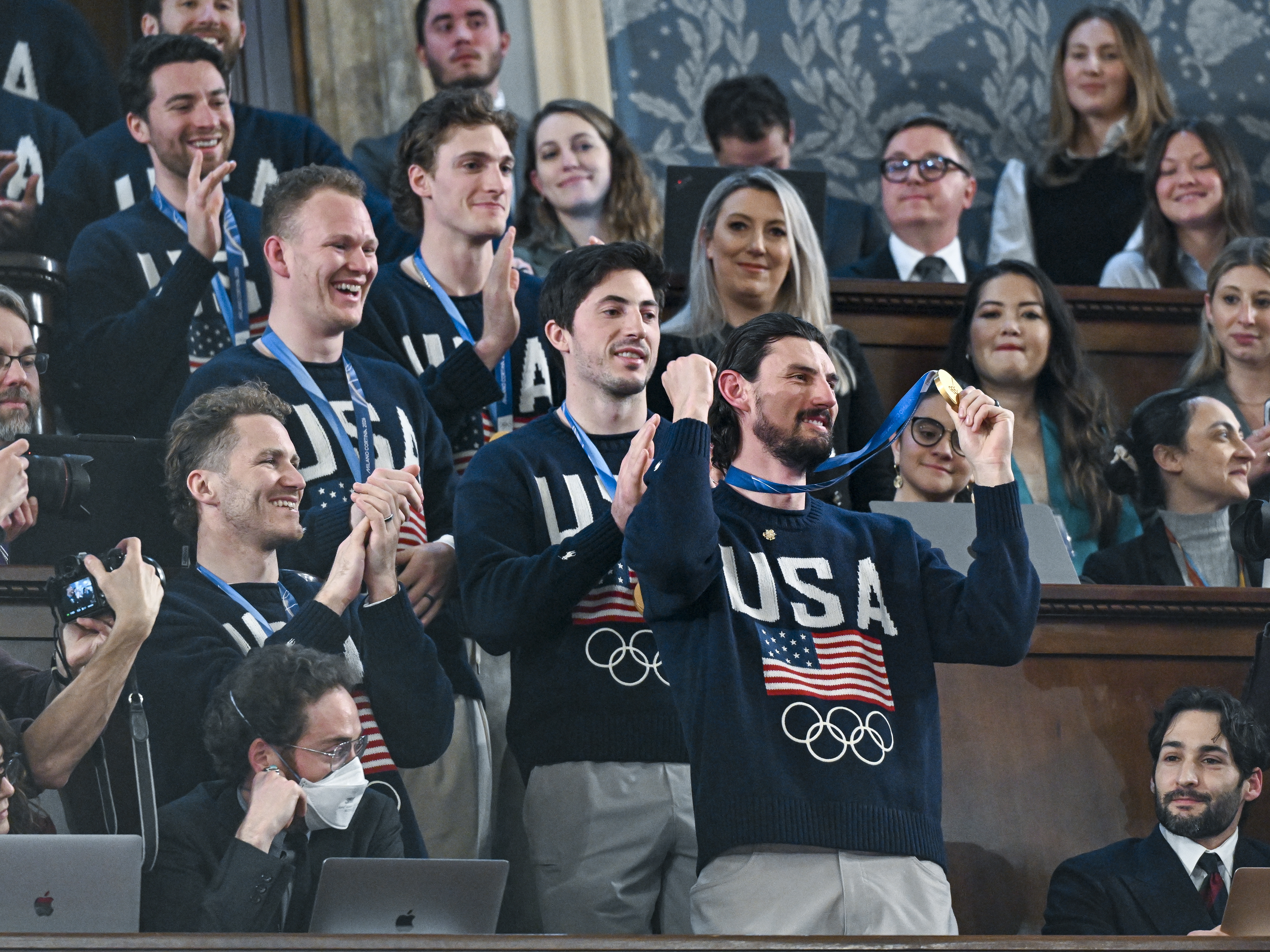 caption: The U.S. men's Olympic ice hockey team attends President Trump's State of the Union address in the House Chamber at the Capitol on Tuesday in Washington, D.C.