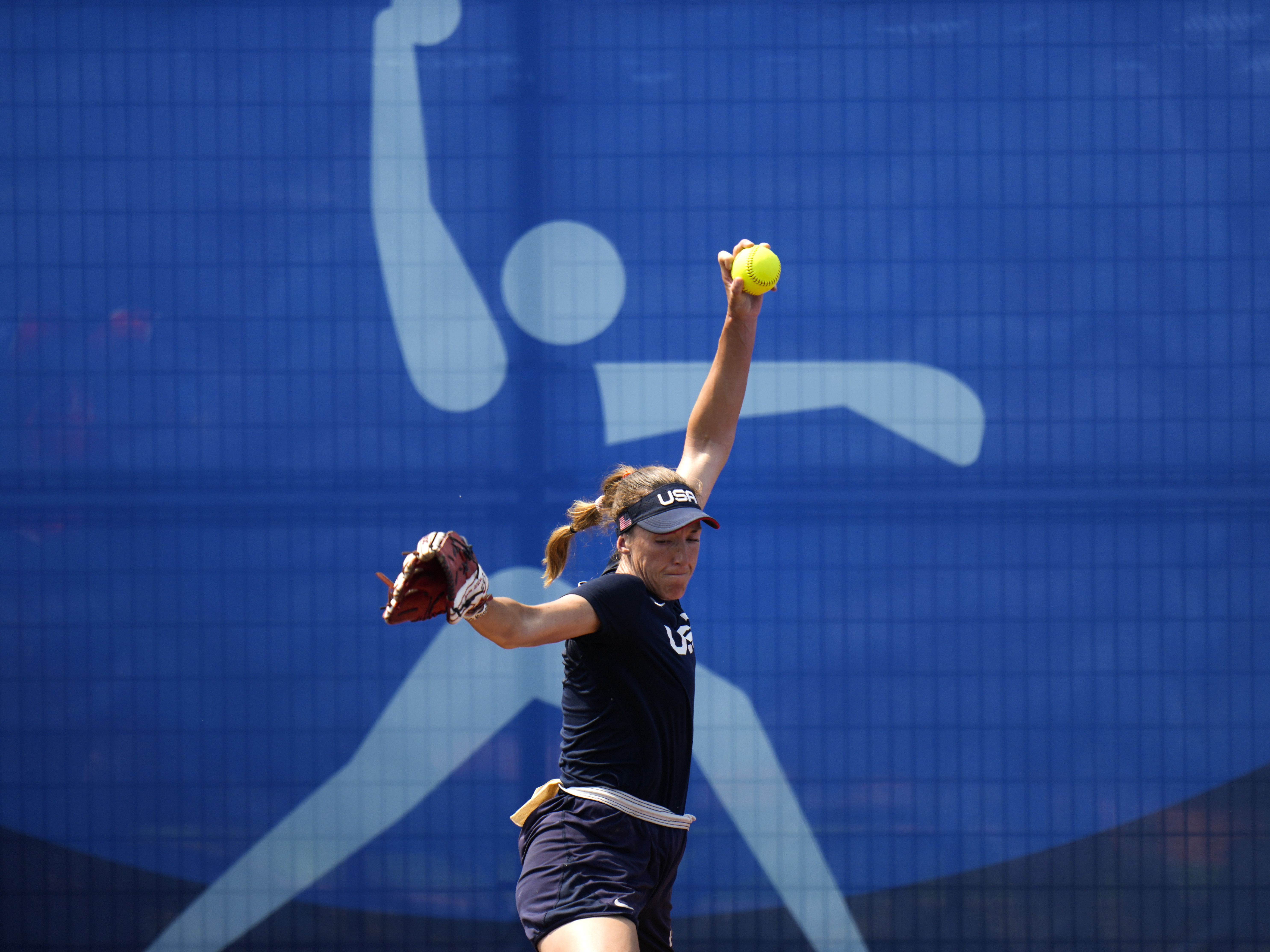 caption: United States pitcher Monica Abbott trains at the Fukushima Azuma Baseball Stadium ahead of the 2020 Summer Olympics, Tuesday, July 20, 2021, in Fukushima, Japan.