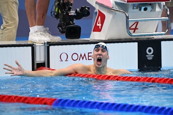 caption: Chase Kalisz of the U.S. celebrates after winning the final of the men's 400m individual medley swimming event during the Tokyo 2020 Olympic Games on Sunday.