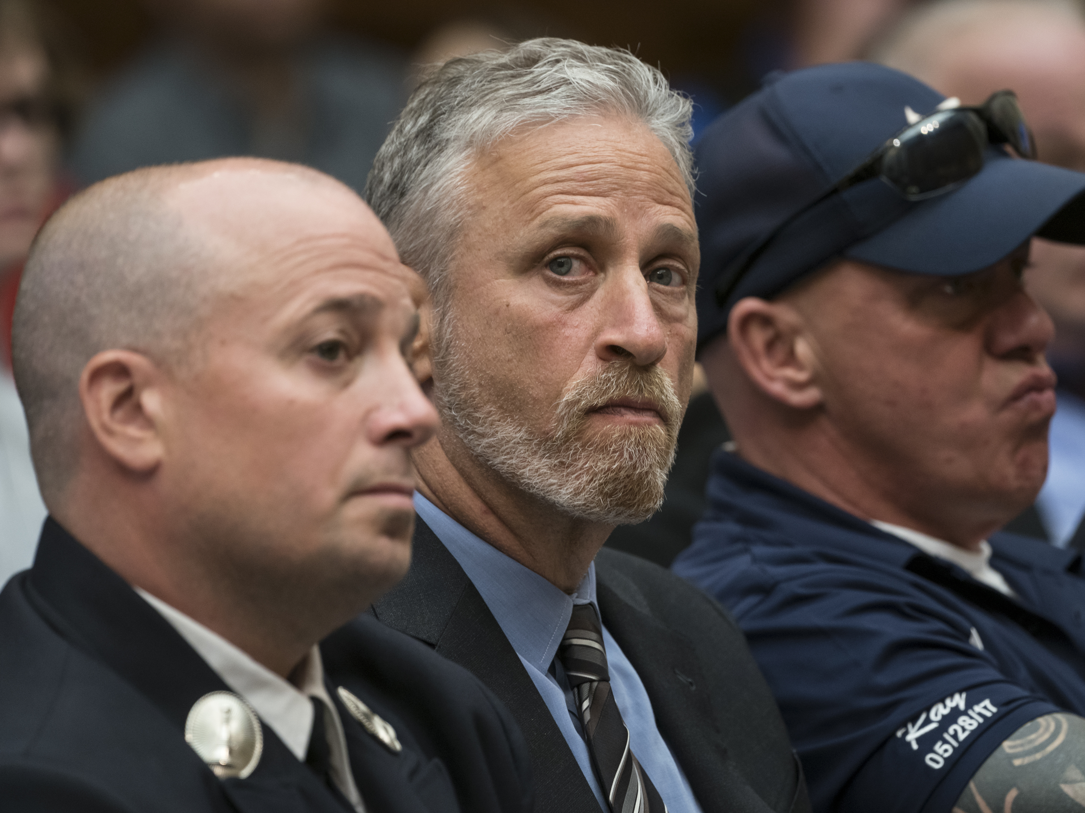 caption: TV personality Jon Stewart at a hearing by the House Judiciary Committee as it considers permanent authorization of the Victim Compensation Fund on Capitol Hill in Washington.