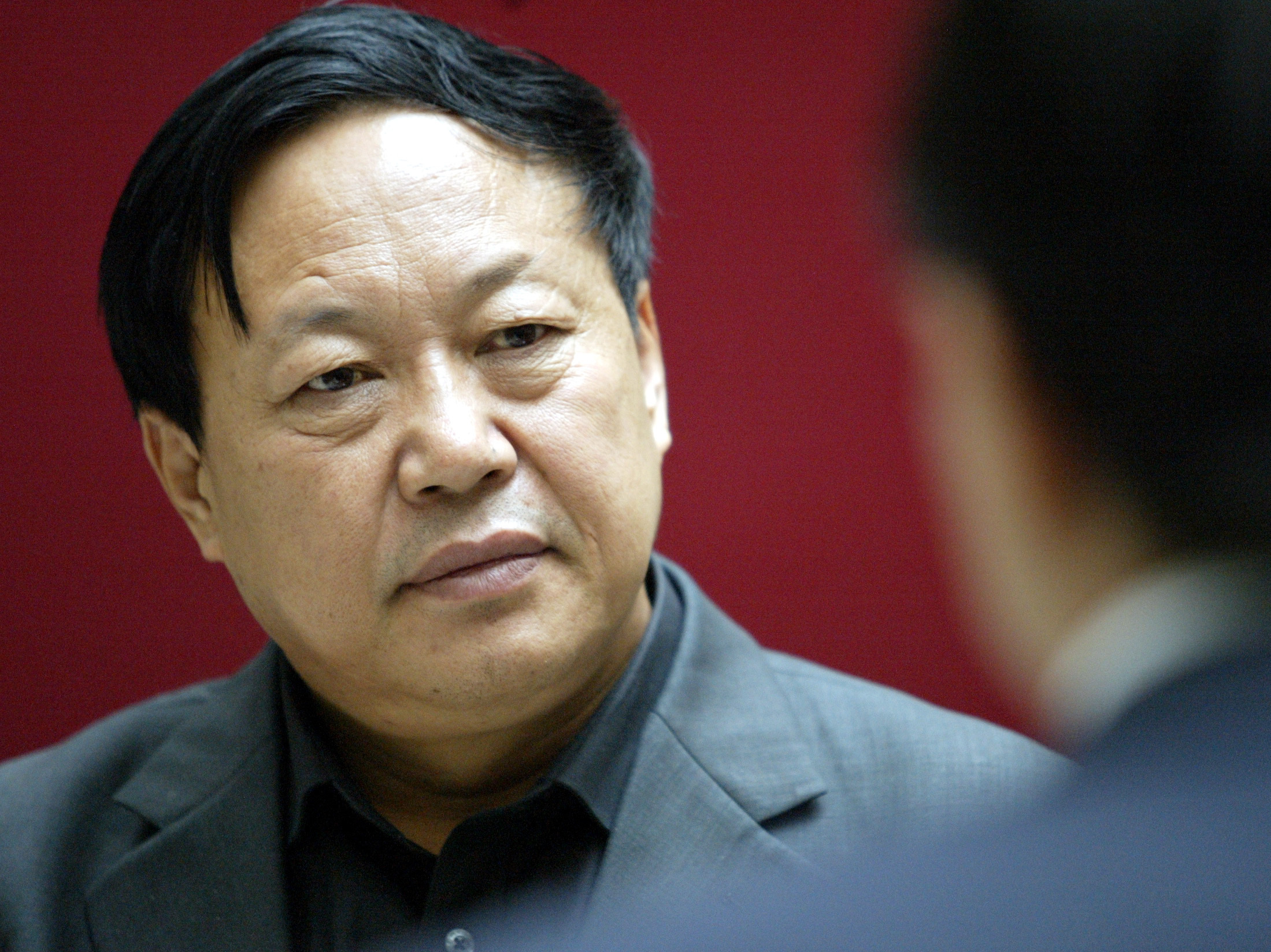 caption: Sun Dawu, shown here in 2005, was sentenced in a court in Hebei province on Wednesday. The billionaire pig farmer was found guilty of eight charges, including gathering crowds to attack state agencies, illegal fundraising and "provoking trouble." Few onlookers were allowed access to the trial, despite earlier assurances that his relatives and employees could attend.