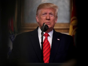 caption: President Trump makes a statement in the Diplomatic Reception Room of the White House on Sunday, announcing the death of ISIS leader Abu Bakr al-Baghdadi.