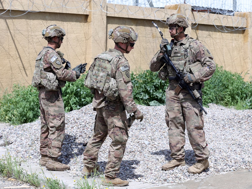 caption: U.S. troops participated in a March handover to the Iraqi Army in Kirkuk, Iraq. The U.S. plans to draw down its troop numbers in the country this month.