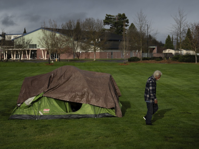 caption: A homeless person walks near an elementary school in Grants Pass, Ore., on March 23.  The rural city became the unlikely face of the nation's homelessness crisis when it asked the U.S. Supreme Court to uphold its anti-camping laws. 