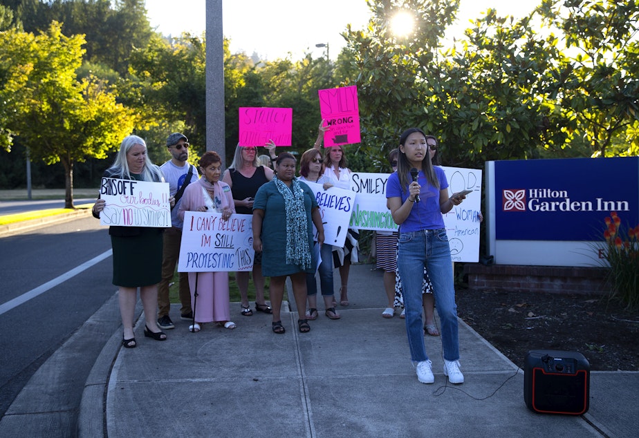 caption: Jean Yu, 17, urges voters to support abortion rights and U.S. Sen. Patty Murray, on Tuesday, August 2, 2022, outside of a Republican primary election night party at the Hilton Garden Inn in Issaquah. 