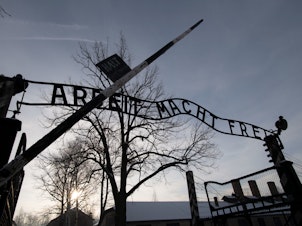 caption: Holocaust survivors visited the former Auschwitz concentration camp on International Holocaust Remembrance Day.