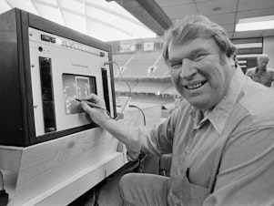 caption: Former Oakland Raiders coach John Madden practices the electronic charting device Telestrator on Jan. 21, 1982, for the Super Bowl broadcast on CBS. Madden, the Hall of Fame coach turned broadcaster, died Tuesday morning, Dec. 28, 2021.