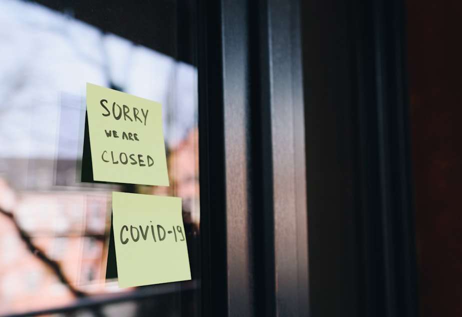 caption: closed COVID restriction shutdown business sign