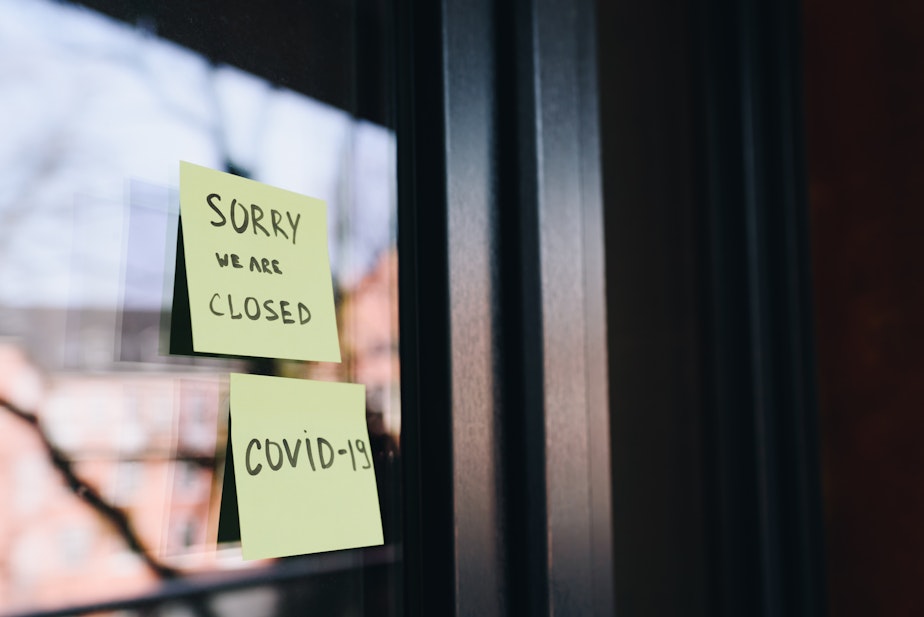 caption: closed COVID restriction shutdown business sign
