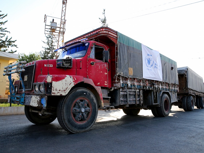 caption: A World Food Programme convoy carries humanitarian aid to Aleppo, Syria. Getting food into conflict zones is a major hurdle — and a topic of discussion at the WFP's Innovation Accelerator.