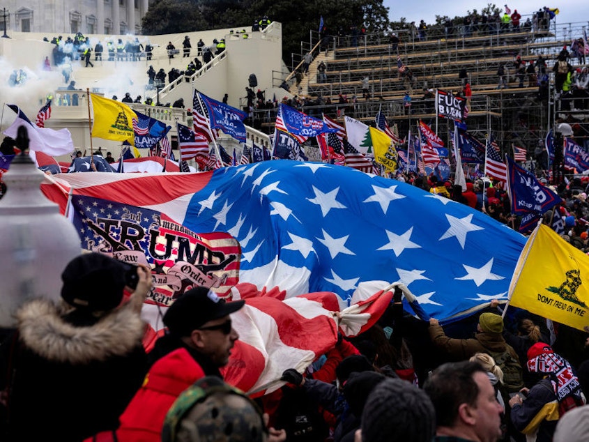 caption: Supporters of former President Donald Trump clash with police and security forces as people storm the U.S. Capitol on Jan. 6.