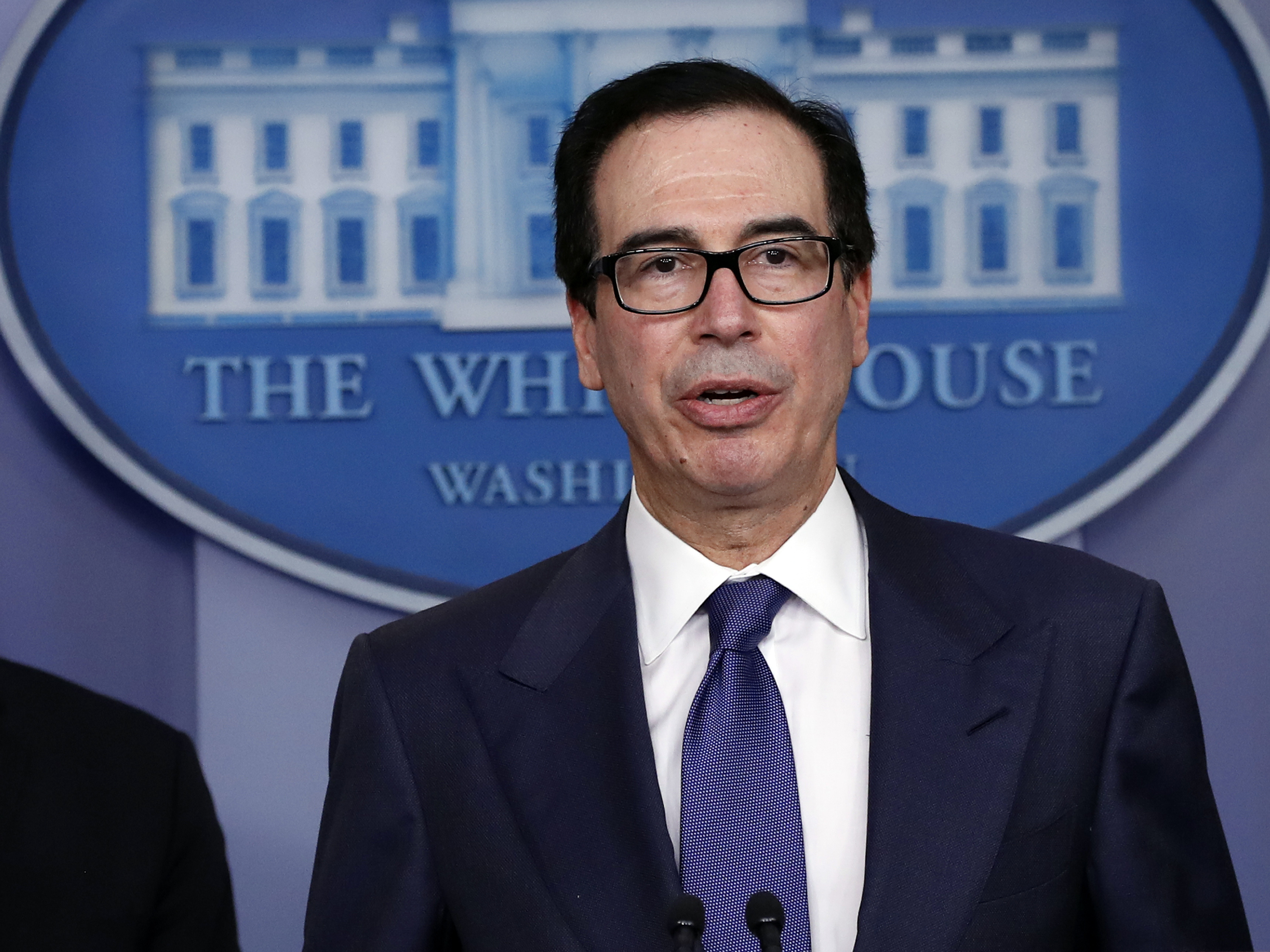 caption: Treasury Secretary Steven Mnuchin speaks about the coronavirus at the White House on March 25. The Treasury said Monday it expects to borrow nearly $3 trillion in the April-June quarter.