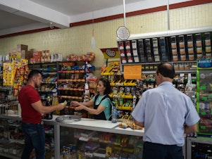 caption: A person buys soda at a convenience store in San Luis Potosi, Mexico, on April 13. The country has high levels of obesity and medical conditions that health authorities warn are related to a diet high in soda and processed foods.
