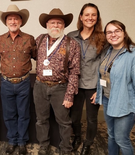caption: Two of Scofield’s students at the International Gay Rodeo Association in 2019. From left to right: Patrick Terry, Cowboy Frank Harrell, Renae Campbell, and Saraya Flaig.