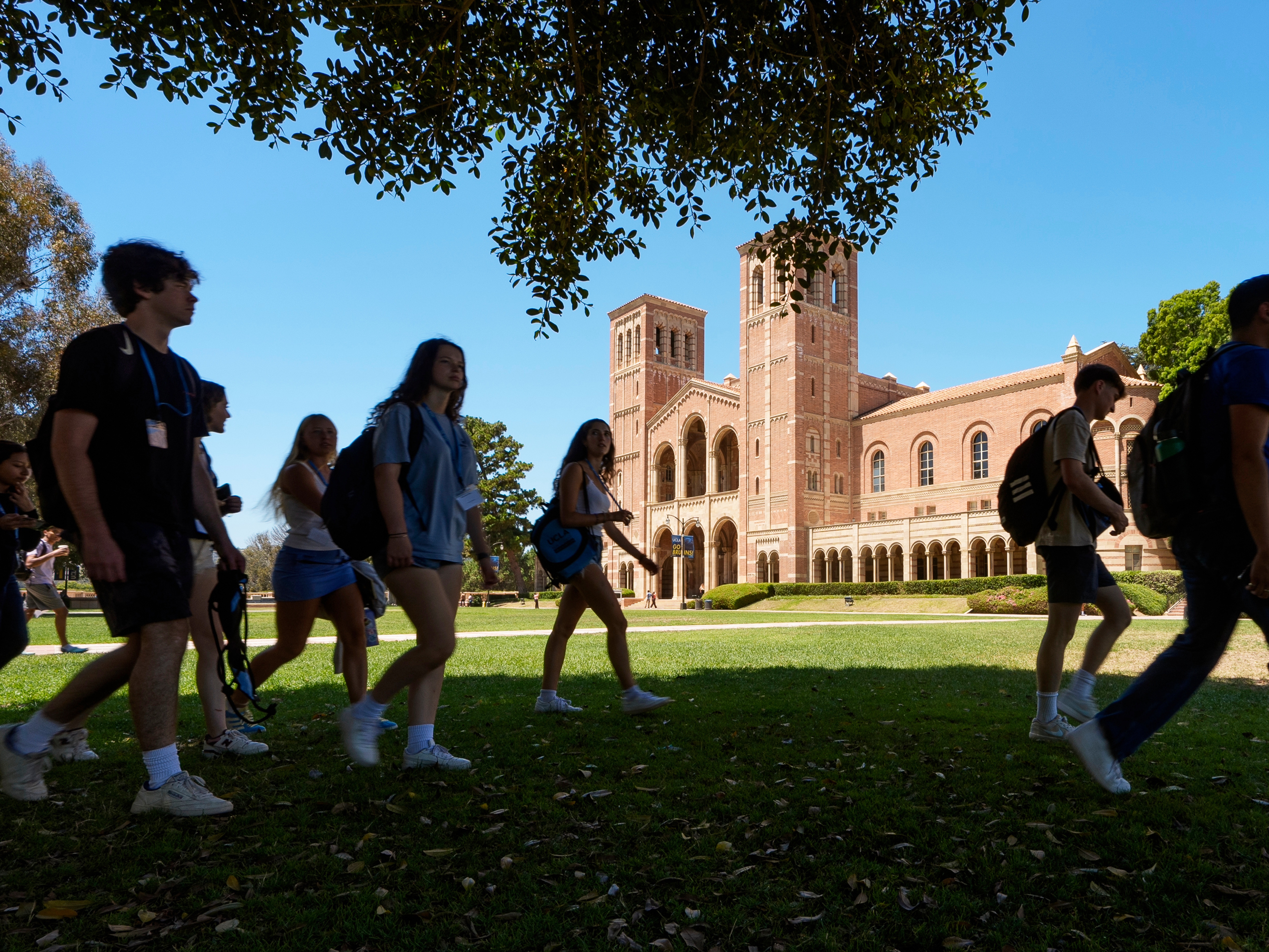 caption: Students walk past Royce Hall on the University of California, Los Angeles campus on Aug. 15, 2024.
