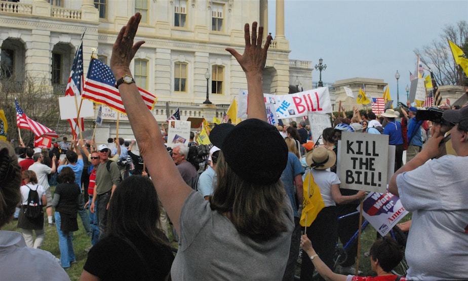 caption: Tea Party protesters demostrating in the streets.