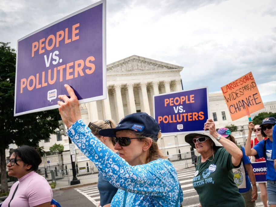 caption: Environmental activists rally in front of the U.S. Supreme Court in 2022 after it ruled against the Obama administration's plan to cut climate-warming emissions at the nation's power plants. The Supreme Court has since further limited the power of federal agencies like the Environmental Protection Agency.