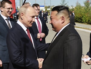 caption: Russian President Vladimir Putin, left, and North Korea's leader Kim Jong Un shake hands during their meeting at the Vostochny cosmodrome outside the city of Tsiolkovsky, about 200 kilometers (125 miles) from the city of Blagoveshchensk in the far eastern Amur region, Russia, on Wednesday, Sept. 13, 2023.