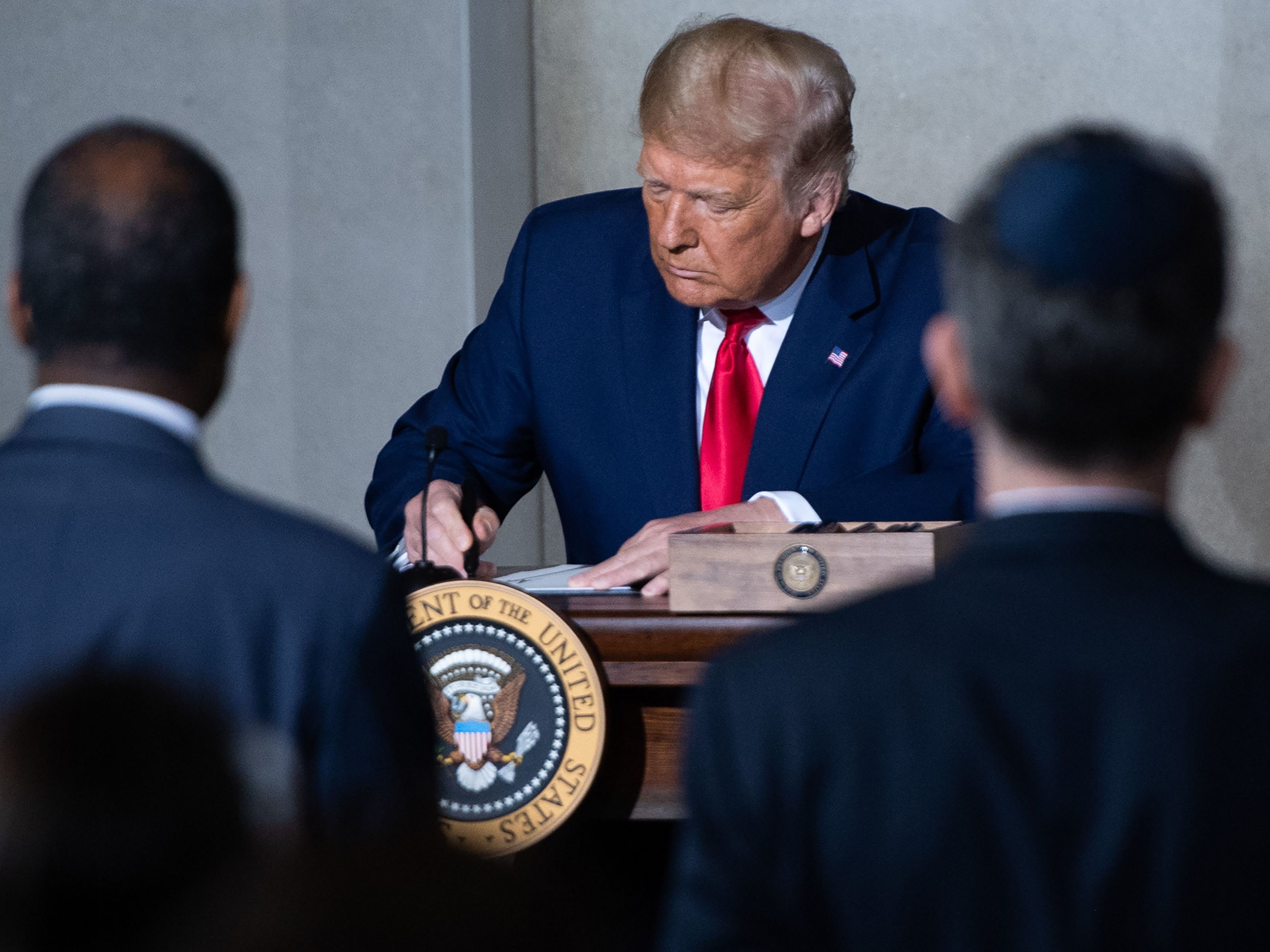 caption: President Trump holds a Constitution Day proclamation after speaking Thursday during the White House Conference on American History at the National Archives in Washington, D.C.