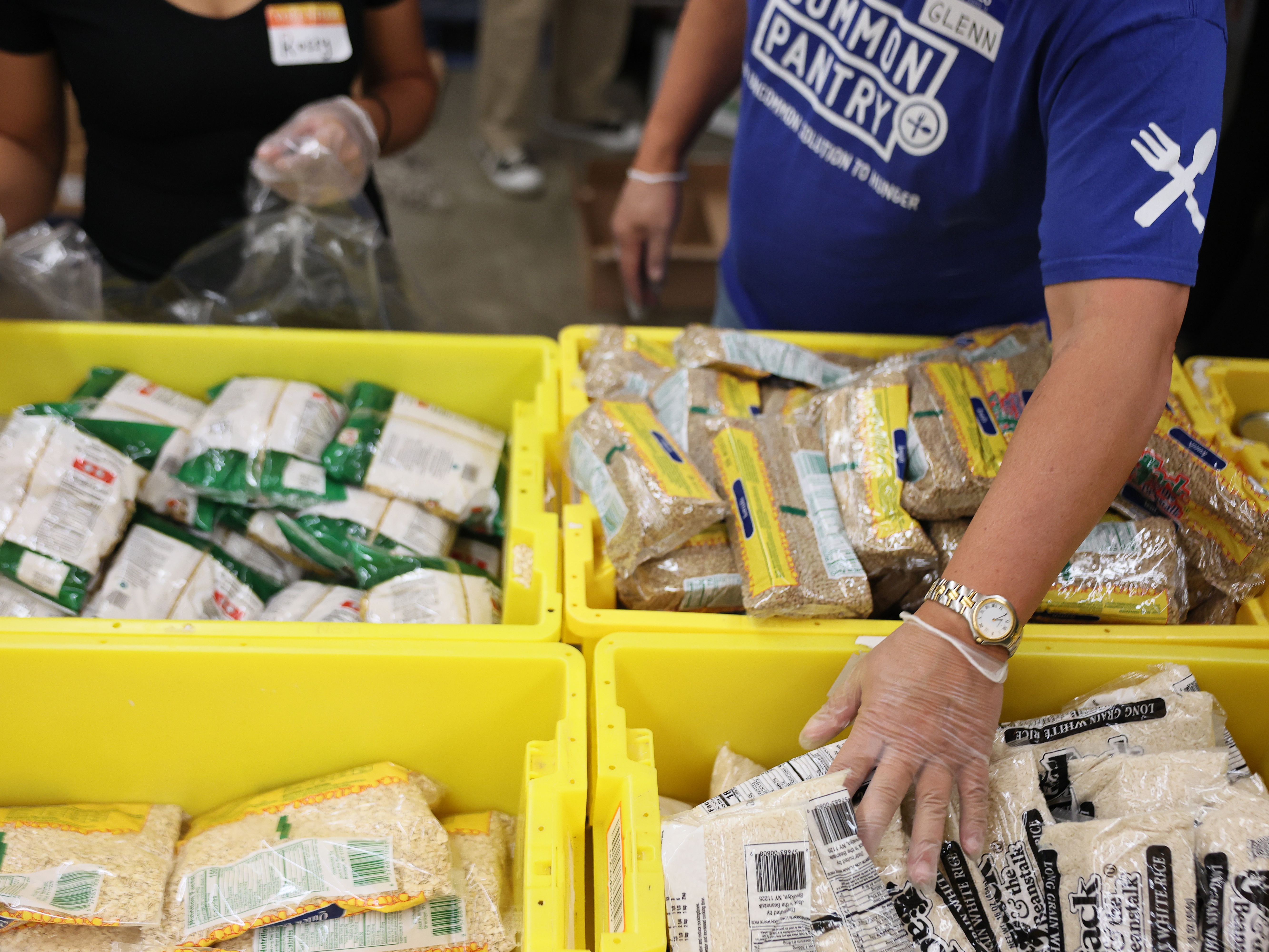 caption: Volunteers with New York Common Pantry help to prepare food packages Wednesday in New York City. Across the country, food banks and food pantries are preparing for a potential surge of people needing food as federal SNAP payments are set to be suspended on Saturday due to the federal government shutdown.