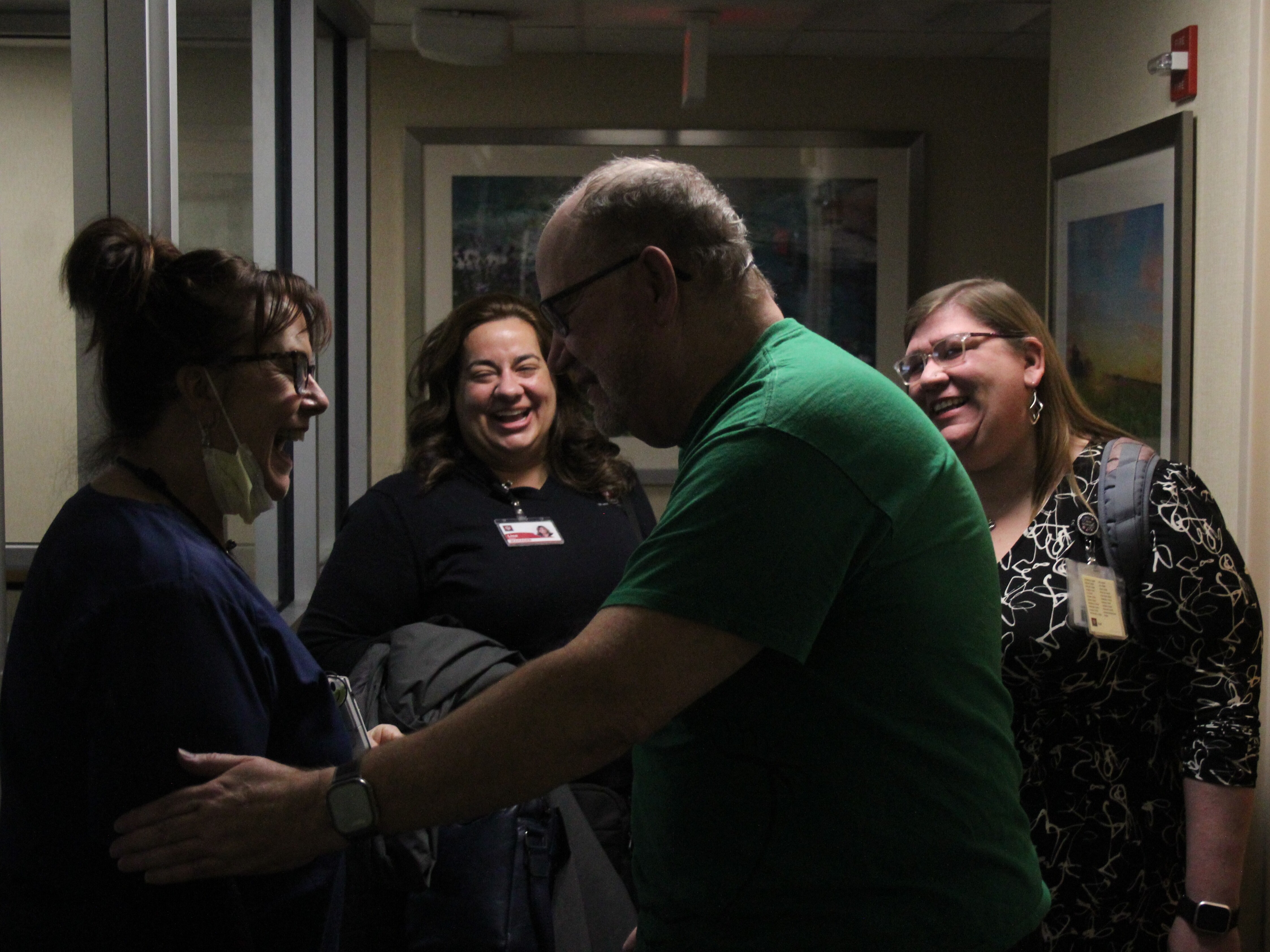 caption: Timothy Moss (right center) was part of a program out of the Indiana University Health system, which connects hospital patients with "connectors" who help fill support needs, including spiritual needs, in the life of the patient.