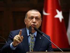 caption: "Covering up such a brutal act would wound the conscience of all mankind," Turkish President Recep Tayyip Erdogan told members of parliament in Ankara, speaking about the death of Saudi journalist and U.S. resident Jamal Khashoggi.