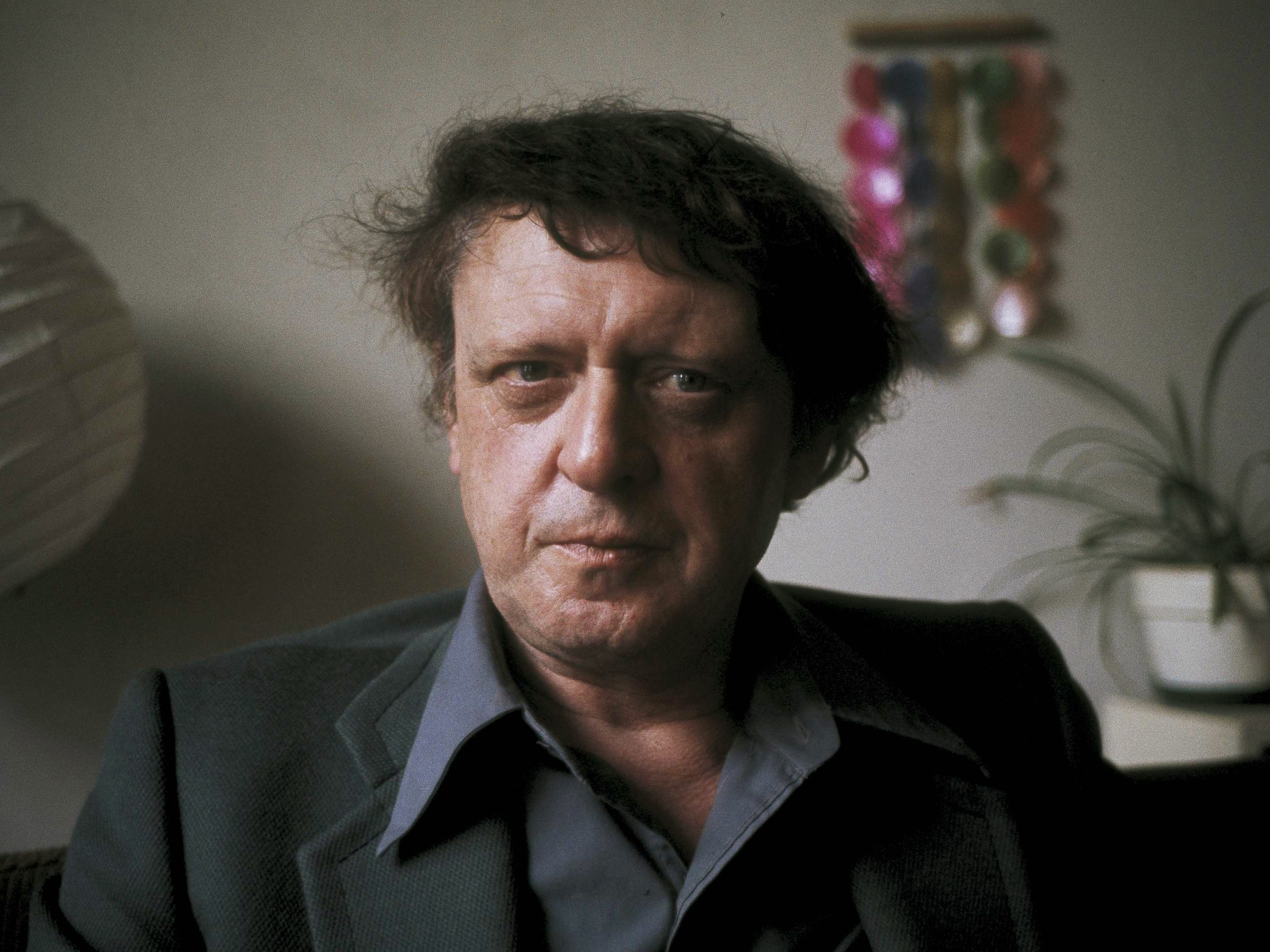 caption: Anthony Burgess poses for a photograph in 1973, two years after the release of the film adaptation of <em>A Clockwork Orange </em>-- and right around the time he was working on the recently unearthed manuscript.