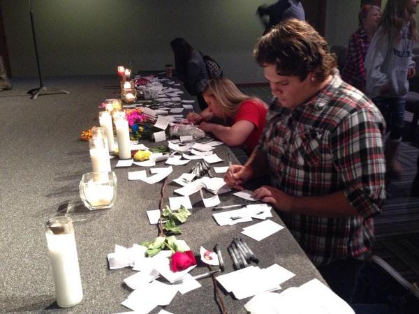 caption: Worshippers at the Grove Church in Marysville, Wash., leave notes of support for victims of shooting at Marysville Pilchuck High School.
