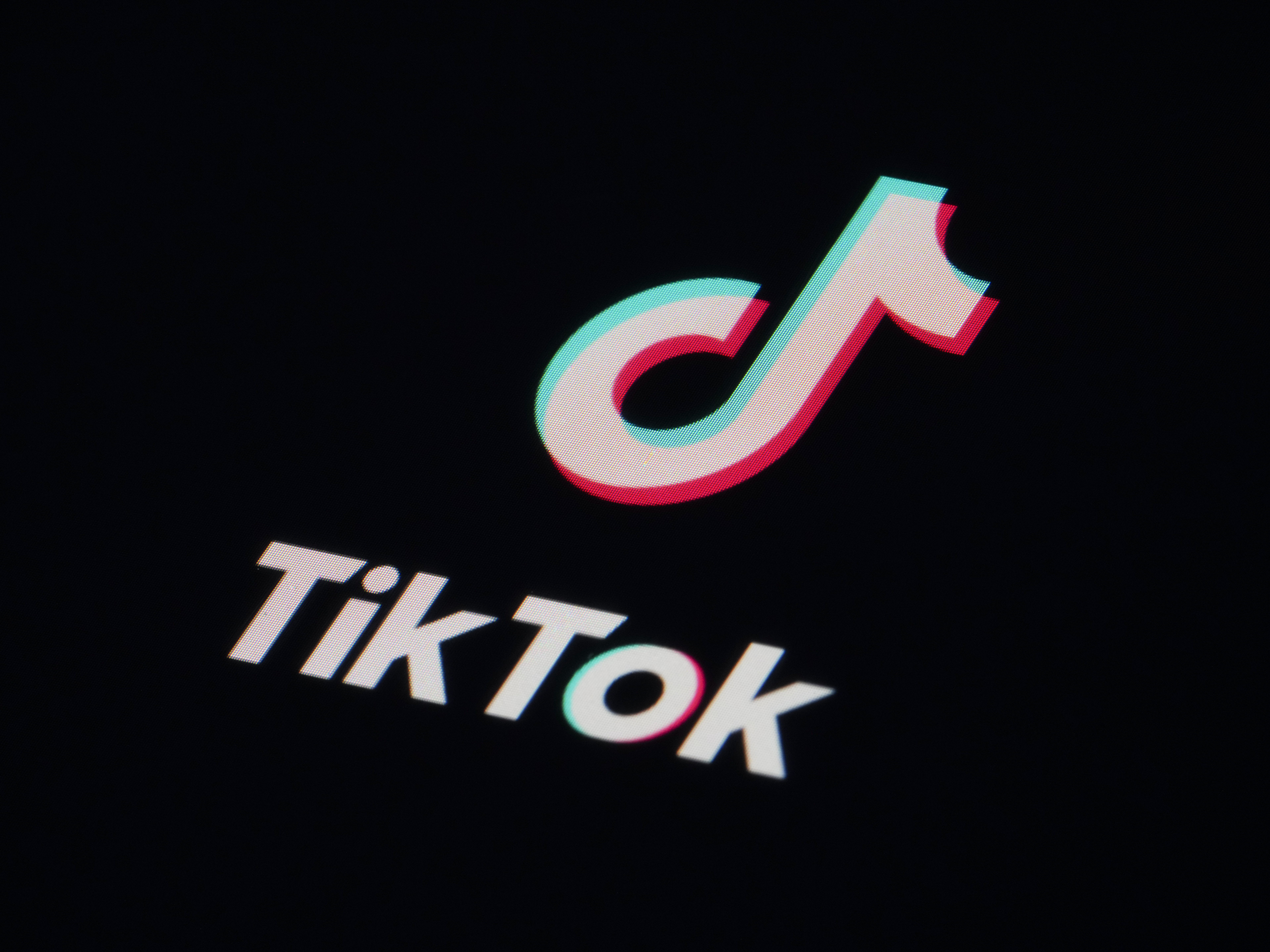 caption: The icon for the video sharing TikTok app is seen on a smartphone on Feb. 28. British authorities said Thursday that they are banning the Chinese-owned app from government mobile phones on security grounds.