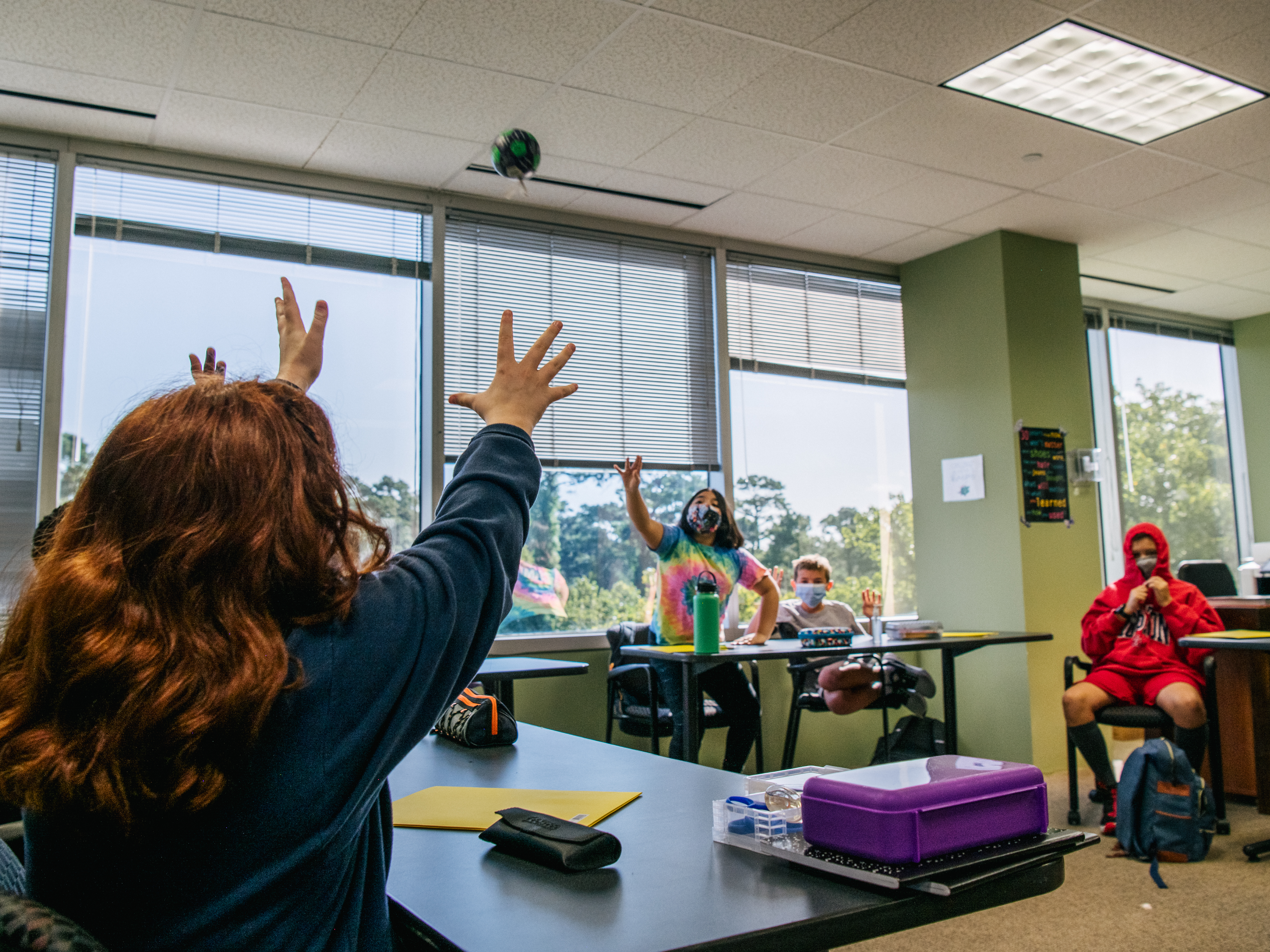 caption: HOUSTON, TEXAS - AUGUST 23: Students at the Xavier Academy, like many schools around Houston, are required to wear masks. Staff and faculty have been vaccinated and 90% of students in attendance have also been vaccinated.
