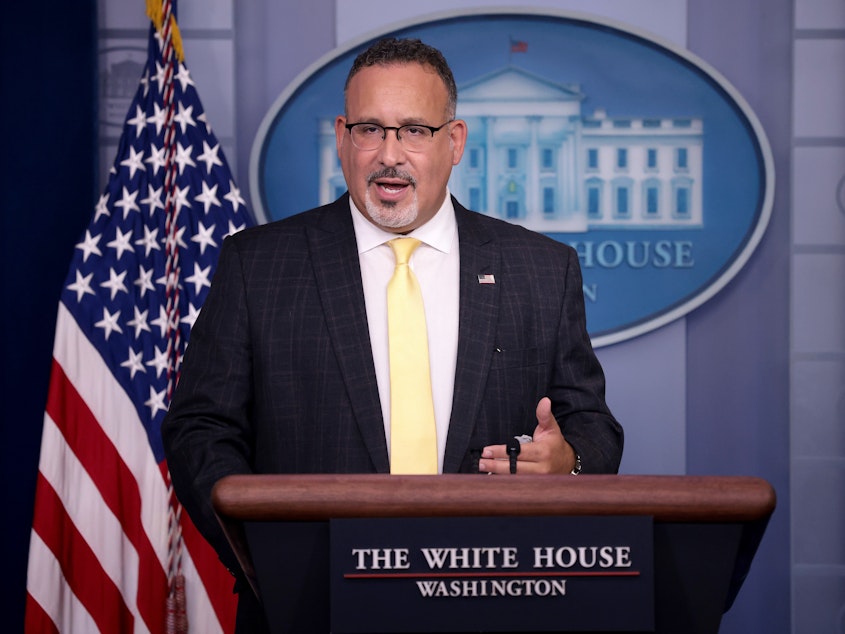 caption: U.S. Education Secretary Miguel Cardona answered questions during a White House press briefing on Thursday.