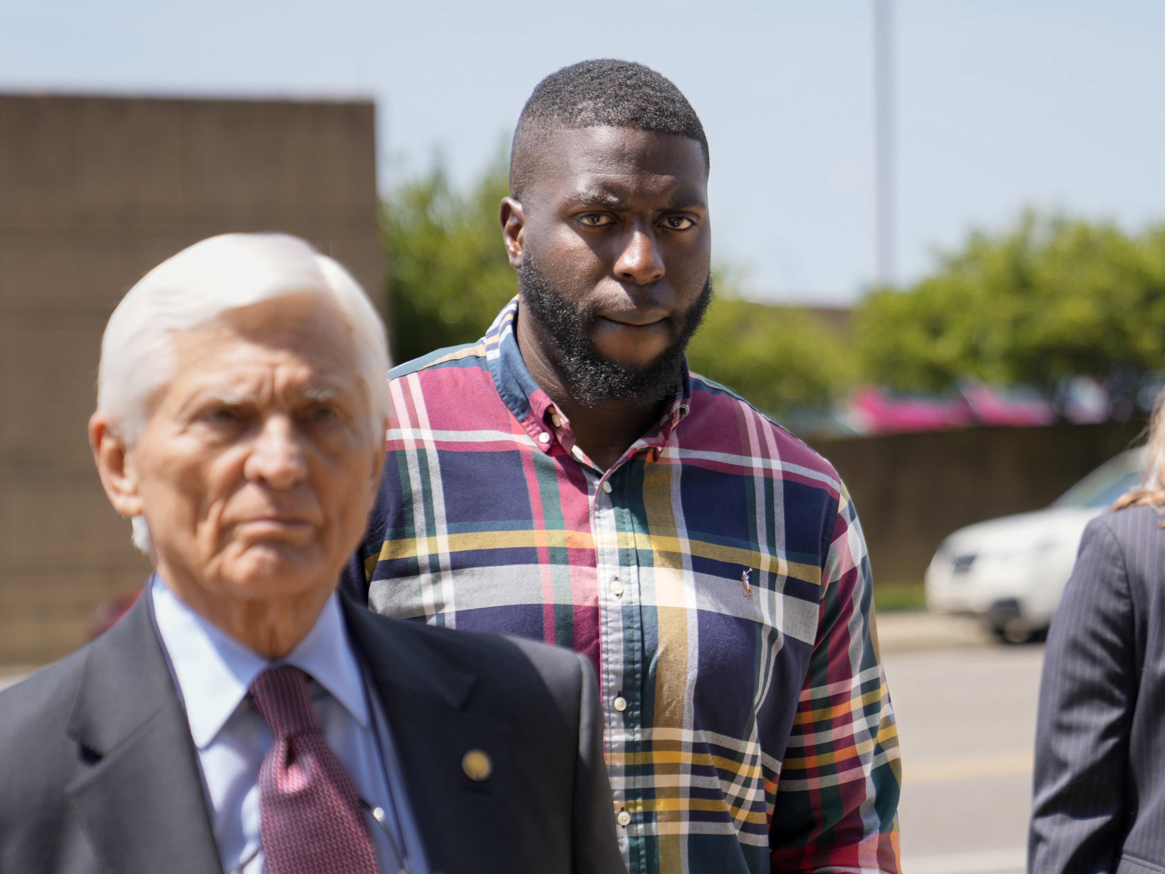 caption: Emmitt Martin III, a former Memphis Police Department officer, second from left, accused of killing Tyre Nichols, walks into federal court on Friday in Memphis, Tenn.