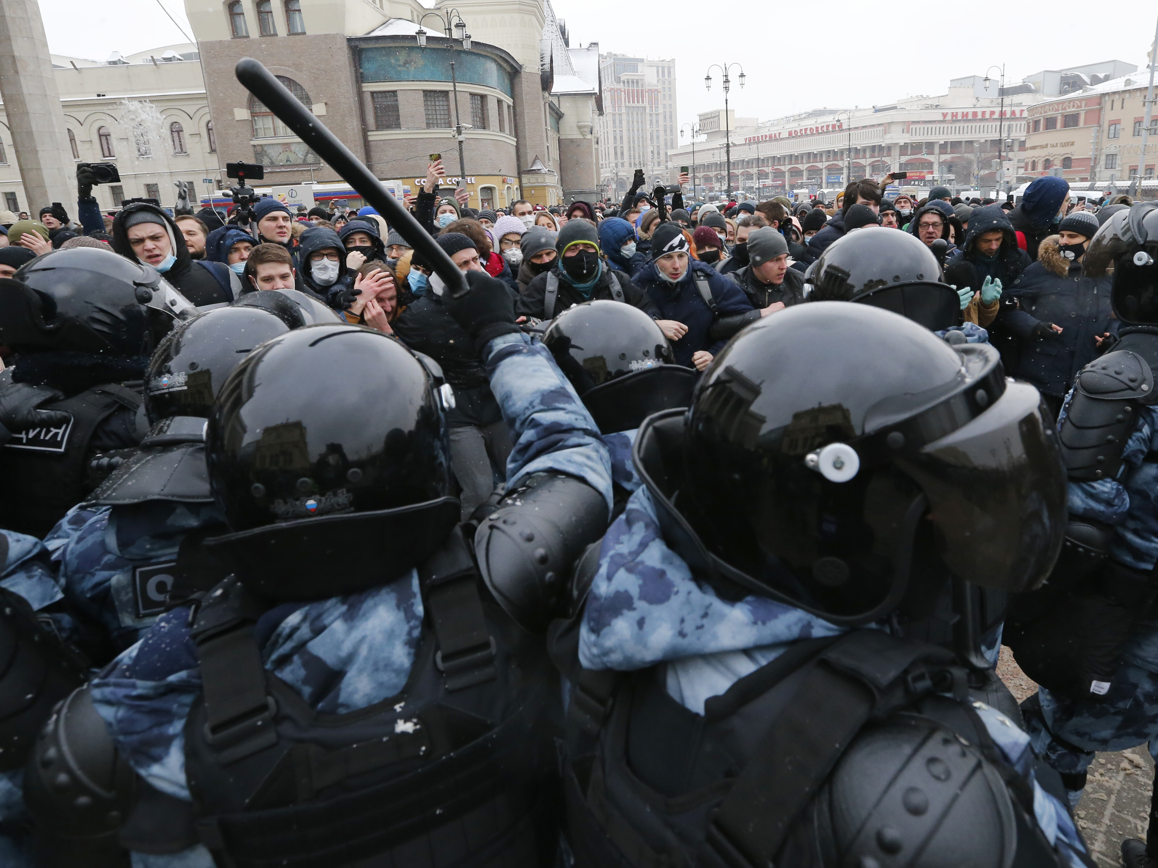 caption: Demonstrators in Moscow clash with police Sunday during a protest against the jailing of Alexei Navalny. Thousands of people took to the streets across Russia to demand the opposition leader's release.