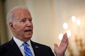 caption: President Biden, pictured on July 19, is set to announce new requirements for federal workers to either get vaccinated or wear masks and get tested regularly.