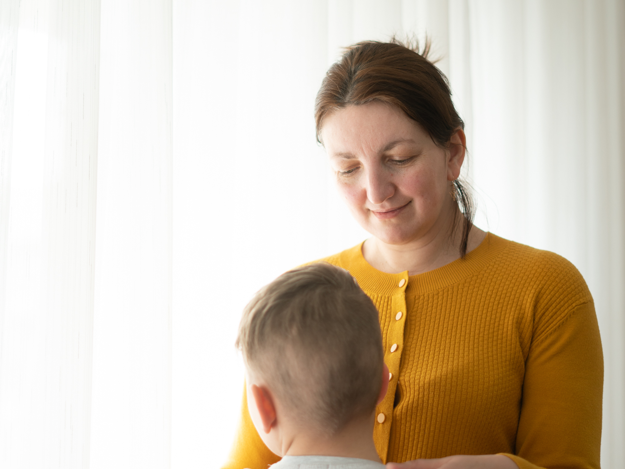 caption: Luba Yaschuk and her three children, including Vanya, 11, were on a vacation in Ukraine when the Russian invasion began. They fled to the Polish border without returning home to gather their belongings.