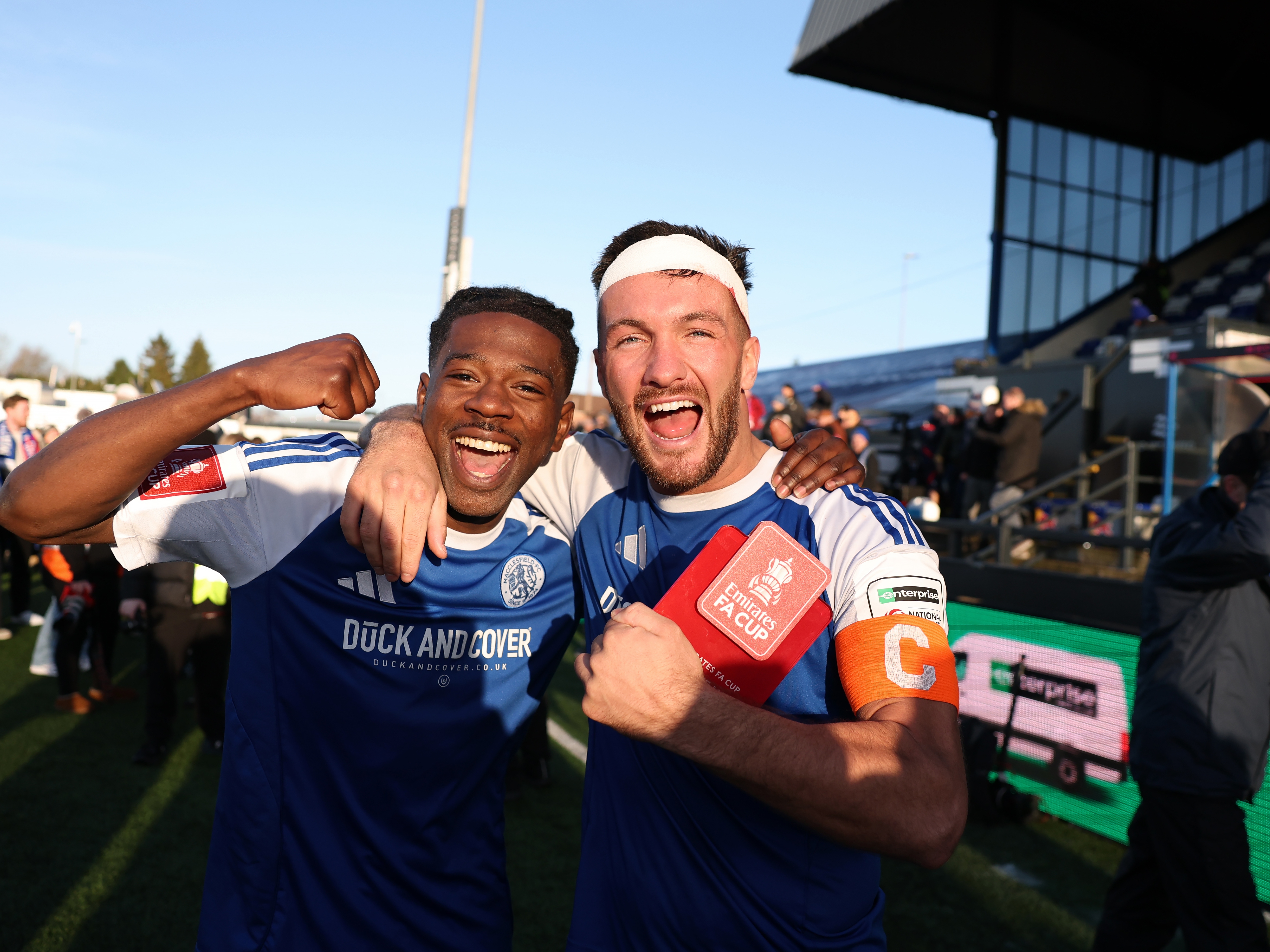 caption: Goal scorers Isaac Buckley-Ricketts and Paul Dawson of Macclesfield celebrate after the team's victory following the Emirates FA Cup Third Round match between Macclesfield and Crystal Palace at Moss Rose Ground on January 10, 2026 in Macclesfield, England.