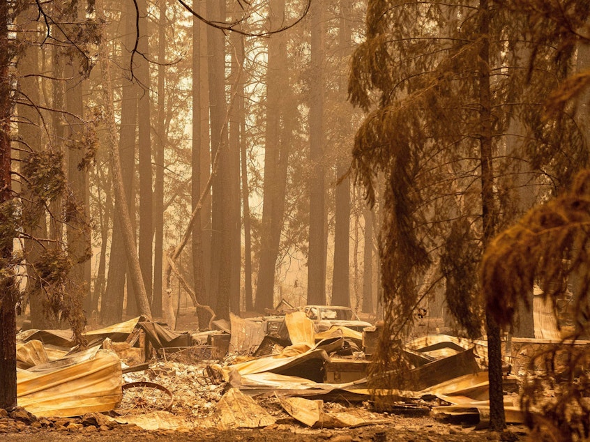 caption: The remains of a burned home are seen in the Indian Falls neighborhood of unincorporated Plumas County, California on July 26, 2021. Extreme weather events have claimed hundreds of lives worldwide in recent weeks, and upcoming forecasts for wildfire and hurricane seasons are dire.