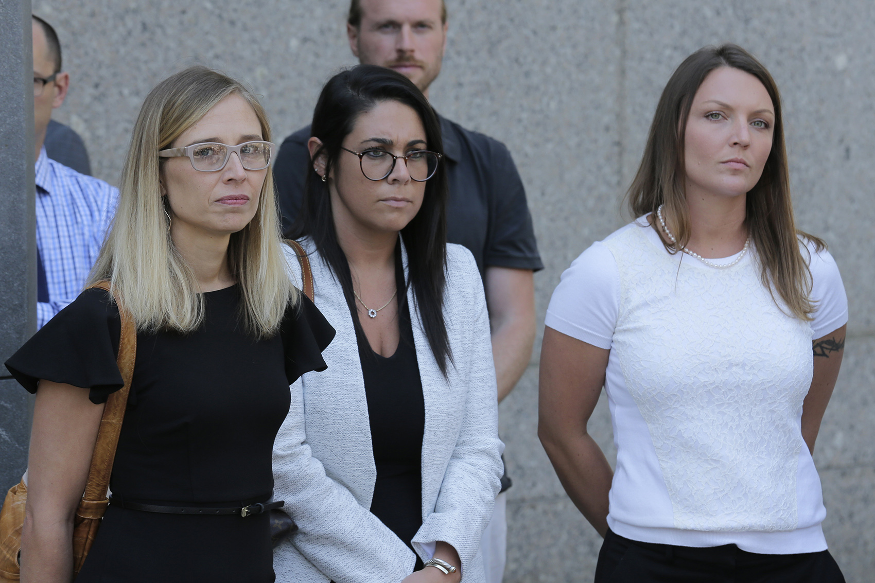 caption: Annie Farmer, left, and Courtney Wild, right, accusers of Jeffery Epstein, stand outside the courthouse in New York, Monday, July 15, 2019. (Seth Wenig/AP)