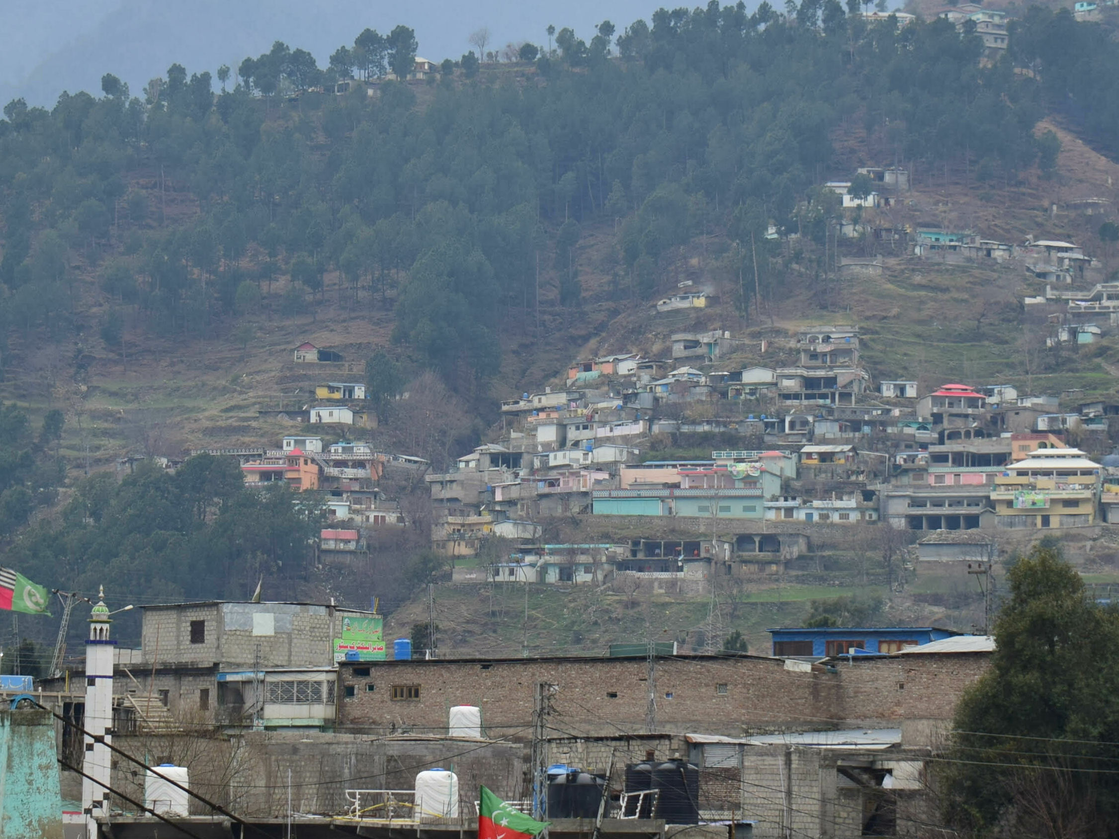 caption: A view of Pakistani village Balakot, Pakistan, Tuesday, Feb. 26, 2019. Maj. Gen Asif Ghafoor, a military spokesman, said the Indian "aircrafts" crossed into the Pakistan-controlled sector of Kashmir. He said Pakistan scrambled fighters and the Indian jets "released payload in haste," near Balakot, on the edge of Pakistani-ruled Kashmir. (AP Photo/Aqeel Ahmed)