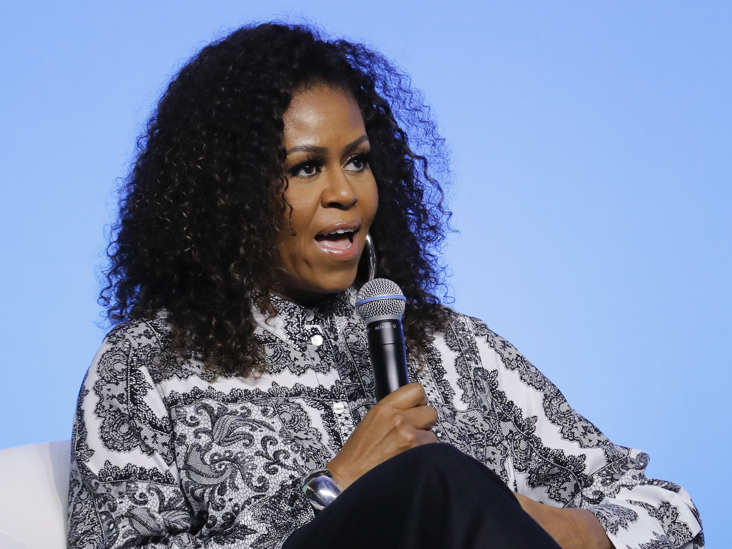 caption: Michelle Obama said on her podcast that she's been having trouble sleeping and has been feeling depressed. "Spiritually, these are not ... fulfilling times," she said. Obama is seen here in December 2019.